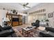 Inviting living room featuring plush seating, a stylish rug, and sliding glass doors at 9208 Butler Blvd, Weeki Wachee, FL 34613