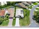 An aerial view of a well-maintained home, showcasing its manicured lawn and the surrounding residential neighborhood at 9400 New Orleans Dr, Weeki Wachee, FL 34613