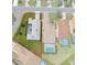 An aerial shot depicts the home's position within a community featuring mature landscaping, and a screened-in patio at 9400 New Orleans Dr, Weeki Wachee, FL 34613
