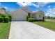 Lovely single-story home with a pristine driveway and well-maintained landscaping, featuring a neutral color palette at 9400 New Orleans Dr, Weeki Wachee, FL 34613