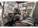 Golf cart featuring comfortable seating and modern dashboard inside garage with storage shelves at 9400 New Orleans Dr, Weeki Wachee, FL 34613