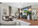 Cozy living room featuring a fireplace, plush seating, and a large TV above the mantle at 9400 New Orleans Dr, Weeki Wachee, FL 34613