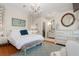 Elegant main bedroom with a chandelier, wood floors, and a walk-in closet at 9400 New Orleans Dr, Weeki Wachee, FL 34613