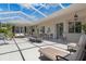 Large screened-in patio featuring ample seating, perfect for relaxing and enjoying the outdoor living space at 9400 New Orleans Dr, Weeki Wachee, FL 34613
