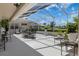 Spacious screened-in patio featuring ample seating, a dining set, and decorative plants, perfect for outdoor entertaining at 9400 New Orleans Dr, Weeki Wachee, FL 34613