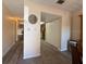 Hallway showing durable wood flooring and neutral walls, creating a seamless transition at 947 Village Dr, Brooksville, FL 34601