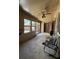 An empty outdoor patio shows two chairs and plenty of sunlight for leisure activities at 947 Village Dr, Brooksville, FL 34601