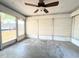 Enclosed Florida room with access to the backyard at 9850 Richwood Ln, Port Richey, FL 34668