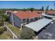 Aerial view of the condo complex featuring carports and community landscaping at 9970 Eagles Point Cir # 3, Port Richey, FL 34668
