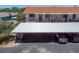 Carport view featuring the building's exterior and stairway at 9970 Eagles Point Cir # 3, Port Richey, FL 34668