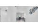 Bright hallway with decor leading into a well-lit living space, highlighting a clean and airy ambiance at 9970 Eagles Point Cir # 3, Port Richey, FL 34668
