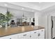 Open concept kitchen with breakfast bar provides extra seating overlooking the dining and living areas at 9970 Eagles Point Cir # 3, Port Richey, FL 34668