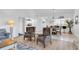 Spacious living room with dining area and kitchen in the background, showcasing the open floor plan at 9970 Eagles Point Cir # 3, Port Richey, FL 34668