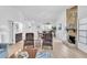 Bright and airy living space with a stone fireplace, open to dining area and kitchen, perfect for gatherings at 9970 Eagles Point Cir # 3, Port Richey, FL 34668
