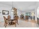 Cozy dining and living area with a fireplace and outdoor views, ideal for Gathering gatherings at 9970 Eagles Point Cir # 3, Port Richey, FL 34668