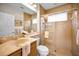 A bathroom with a shower and a single sink vanity with granite countertops at 1033 Tuscany Dr, Trinity, FL 34655