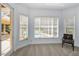 Bedroom with ample windows and a view of the pool and patio at 1033 Tuscany Dr, Trinity, FL 34655