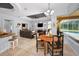 Dining area adjacent to the kitchen and living room offering seamless indoor/outdoor flow at 1033 Tuscany Dr, Trinity, FL 34655