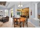 Cozy dining area with a view of the lanai and the pool outside at 1033 Tuscany Dr, Trinity, FL 34655