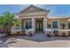 Inviting home exterior with columns, potted plants, and a brick paved walkway leading to a decorative front door at 1033 Tuscany Dr, Trinity, FL 34655