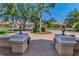 Beautiful view from a landscaped entrance with lamps and flowers highlighting the community's curb appeal at 1033 Tuscany Dr, Trinity, FL 34655