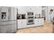 Kitchen features built in oven and microwave, white cabinets and stainless appliances at 1033 Tuscany Dr, Trinity, FL 34655