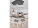 Bright kitchen with a large granite island, stainless appliances, and marble backsplash at 1033 Tuscany Dr, Trinity, FL 34655