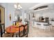 Open-concept kitchen with a breakfast bar, stainless steel appliances, and an adjacent dining area at 1033 Tuscany Dr, Trinity, FL 34655