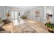 Open-concept living room with neutral palette, tile flooring, and access to dining area at 1033 Tuscany Dr, Trinity, FL 34655