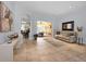 Large living room with tile flooring and seamless indoor/outdoor flow to lanai at 1033 Tuscany Dr, Trinity, FL 34655
