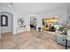 Spacious living room with tile floors, neutral walls, and view of lanai and pool at 1033 Tuscany Dr, Trinity, FL 34655