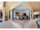 Inviting living room with wood floors and access to the outdoor patio through sliding glass doors at 1033 Tuscany Dr, Trinity, FL 34655