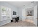 A home office with carpet and a view of the dining room through an open door at 1033 Tuscany Dr, Trinity, FL 34655