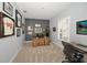 A home office with grey walls, a wood desk, and lots of sports memorabilia on the wall at 1033 Tuscany Dr, Trinity, FL 34655