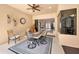 Inviting covered patio features a ceiling fan, comfortable seating, and an open view to the home's interior at 1033 Tuscany Dr, Trinity, FL 34655