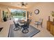 Charming covered patio with furniture, decor, and easy access to a private screened-in pool at 1033 Tuscany Dr, Trinity, FL 34655
