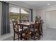 Charming dining area with views of the backyard gazebo, perfect for entertaining at 11137 Addison St, Spring Hill, FL 34609
