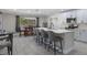 Bright, modern kitchen features an island with seating and stainless steel appliances at 11137 Addison St, Spring Hill, FL 34609