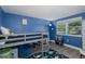 Cozy bedroom featuring a loft bed, window with blinds, and space for storage or play at 12708 River Mill Dr, Hudson, FL 34667