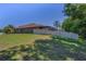 Large, well-maintained backyard enclosed by a white fence, providing privacy and ample space for outdoor activities at 12800 Solola Way, Trinity, FL 34655