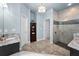 Spacious bathroom with a glass-enclosed shower, dual sinks, and neutral color palette at 12800 Solola Way, Trinity, FL 34655