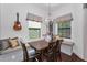 Bright breakfast nook with built-in seating, large windows, modern lighting, and a cozy, inviting atmosphere at 12800 Solola Way, Trinity, FL 34655