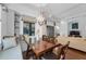 Dining room features a hanging light fixture, large window, and a bench seat at 12800 Solola Way, Trinity, FL 34655