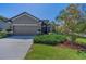 Charming home with manicured landscaping, a well-maintained lawn, and a welcoming front facade at 12800 Solola Way, Trinity, FL 34655