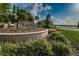 Landscaped entrance sign for Trinity East community, showcasing manicured greenery and welcoming design at 12800 Solola Way, Trinity, FL 34655