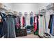 Organized walk-in closet with ample shelving, hanging rods, and storage baskets at 12800 Solola Way, Trinity, FL 34655