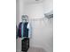 Simple, small walk-in closet featuring built-in shelving and hanging space at 12800 Solola Way, Trinity, FL 34655