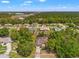 Aerial view of a residential neighborhood featuring well-maintained homes with mature trees and green spaces at 13469 Pia Ct, Spring Hill, FL 34609