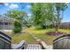 Secluded backyard with a stone path, mature trees, and views of the screened-in lanai at 13469 Pia Ct, Spring Hill, FL 34609