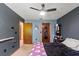 Comfortable bedroom showcasing a ceiling fan and two wooden doors at 13469 Pia Ct, Spring Hill, FL 34609